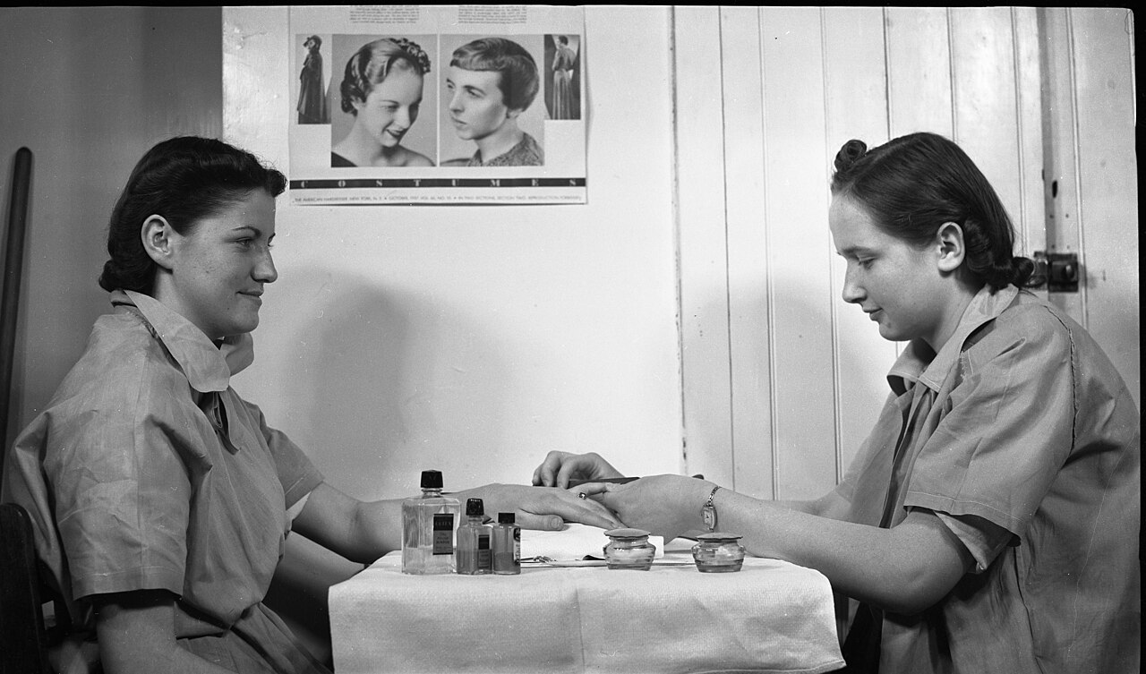 Hands receiving a manicure treatment